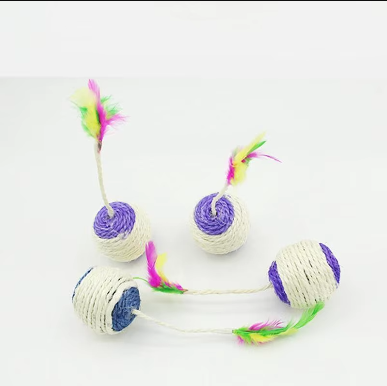 Cat batting an interactive play ball with sisal rope and feather, a perfect kitten scratch toy.