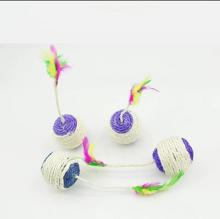 Cat batting an interactive play ball with sisal rope and feather, a perfect kitten scratch toy.