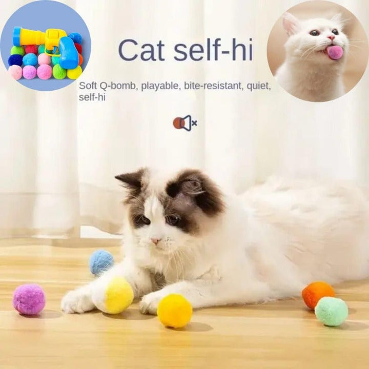 Handheld cat toy launcher gun firing a soft ball, promoting active play for an indoor cat.