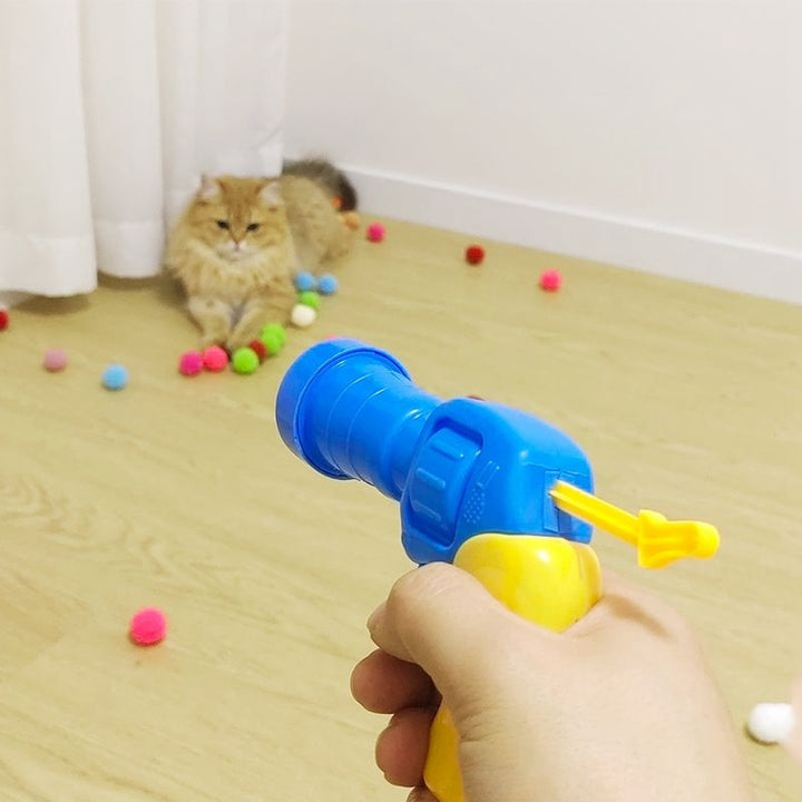 Close-up of the interactive cat toy launcher gun designed for safe, fun pet and owner play.