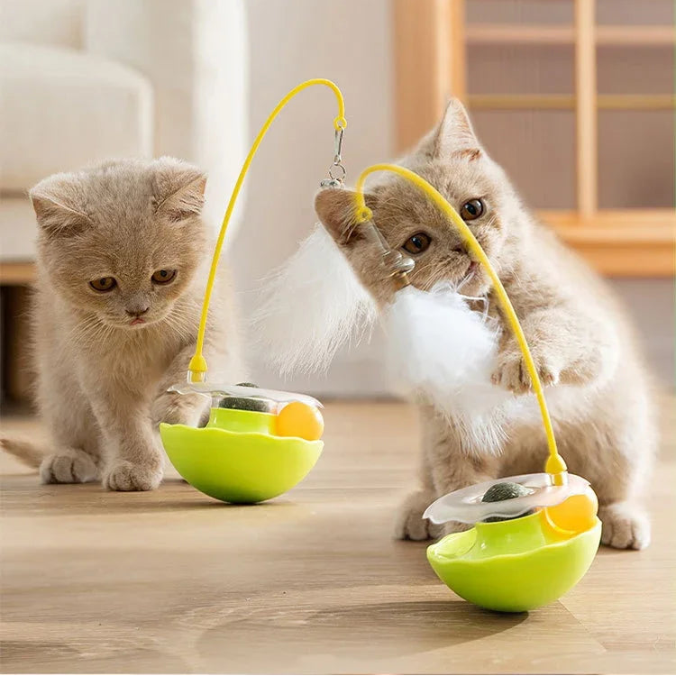 Interactive cat toy tumbler with colorful feathers and an internal bell encouraging pet playtime.