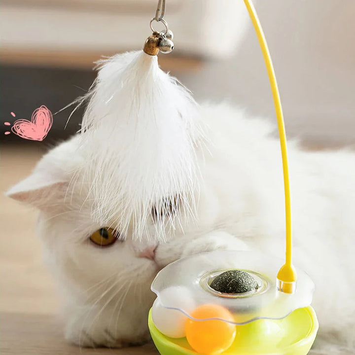 Close-up of a cat toy tumbler with vibrant feathers, an exciting interactive pet enrichment product.