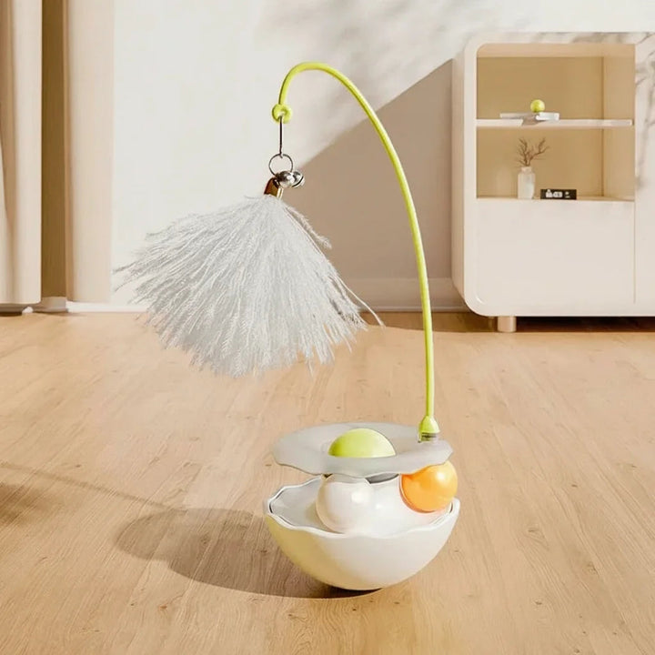 Non-tipping tumbler cat toy with a long feather attachment, perfect for interactive playtime.