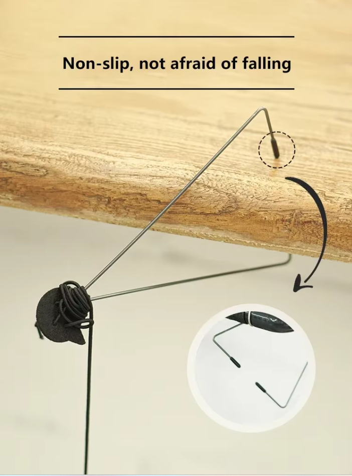 Close-up of a jumping mouse cat toy dangling from a door, stimulating interactive playtime for cats.