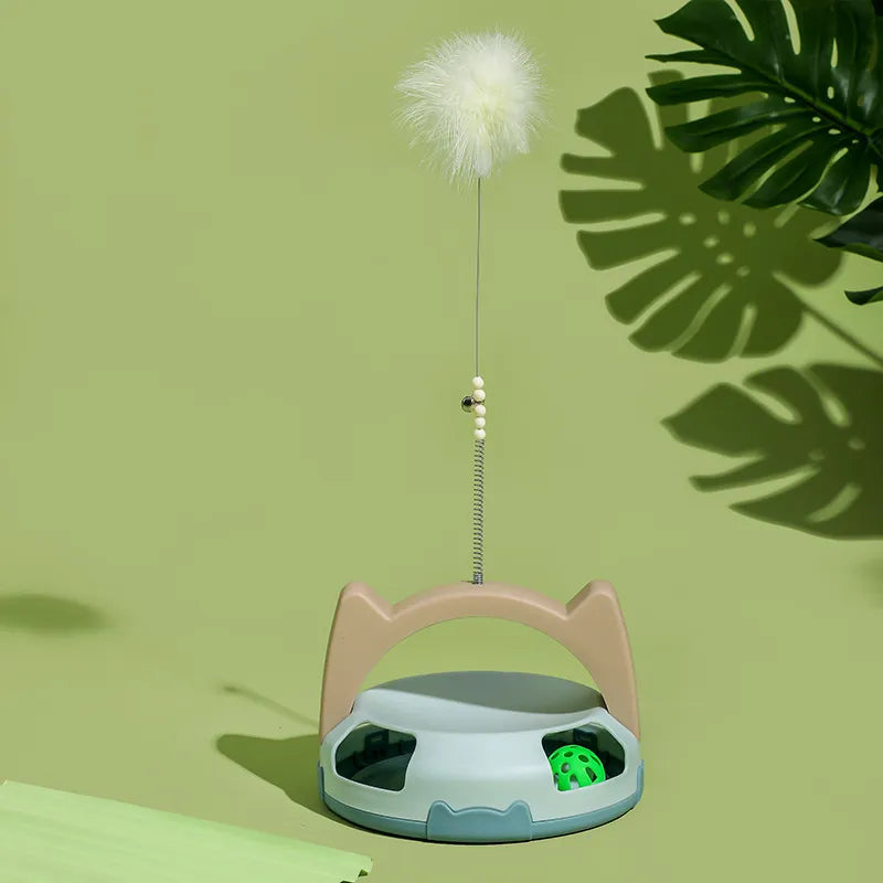 Feline enrichment toy: interactive cat feather wand and a spinning ball puzzle