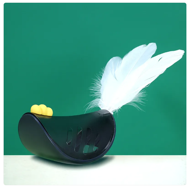 Feline fun: Treat dispensing cat toy featuring a playful feather for mental and physical stimulation