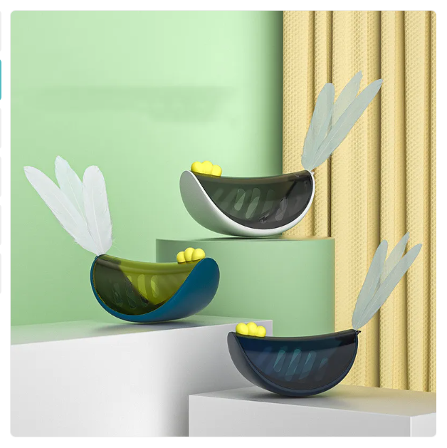 Pet enrichment toy: Cat snack dispenser combined with a feather wand for interactive activity