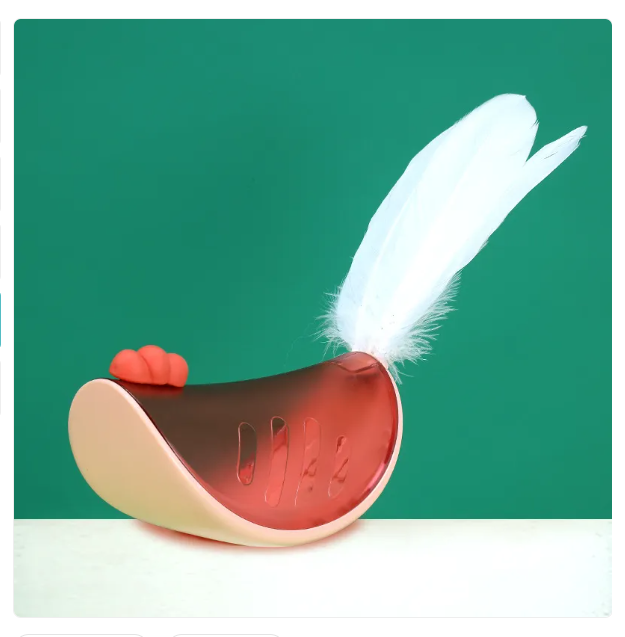 Interactive cat toy with a long feather and snack dispenser for engaging pet play
