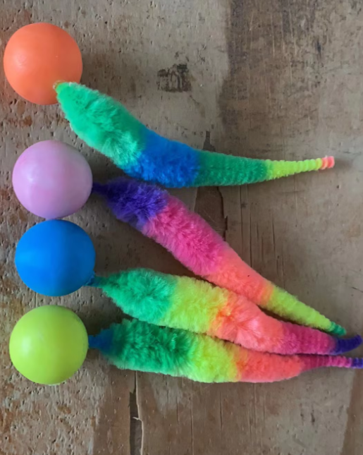 Engaging interactive cat toy featuring a luxurious plush tail and exciting play ball.