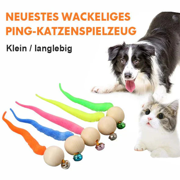 Close-up of interactive cat toy, featuring realistic wagging tail and a small bell for enrichment