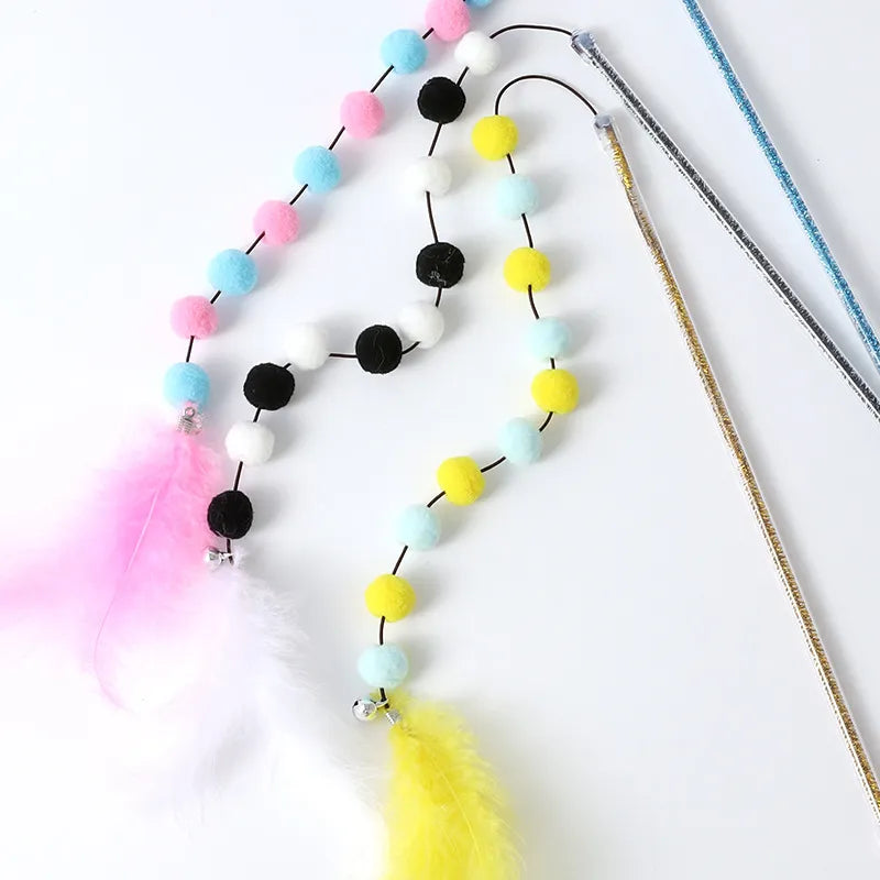 Playful cat wand with multiple pompoms and feathers, ideal interactive toy for kittens and adult cats.