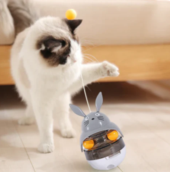 Close-up of Cat Wiggle Treat Dispenser Toy with treats inside, engaging and enriching play