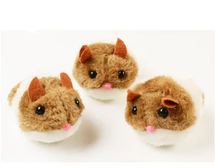 Cat batting an interactive electric plush hamster toy for exercise