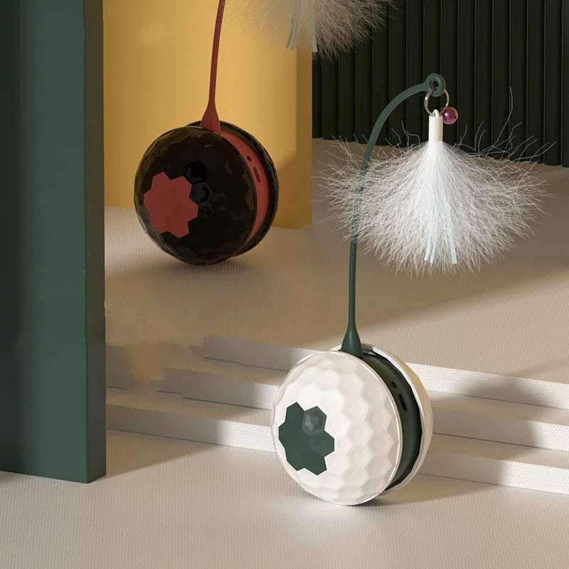 Close-up of interactive cat toy ball with a colorful feather and flexible spring, pet enrichment