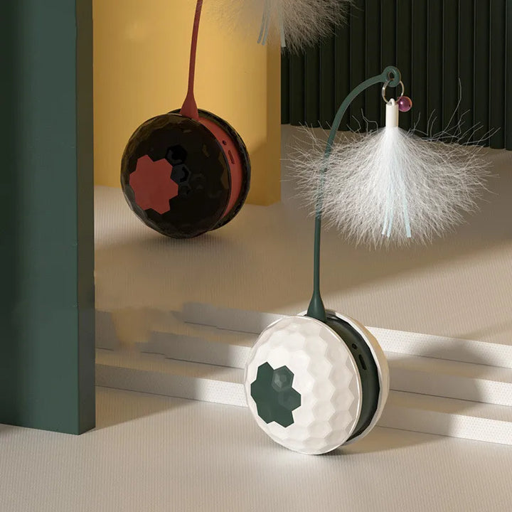 Close-up of interactive cat toy ball with a colorful feather and flexible spring, pet enrichment