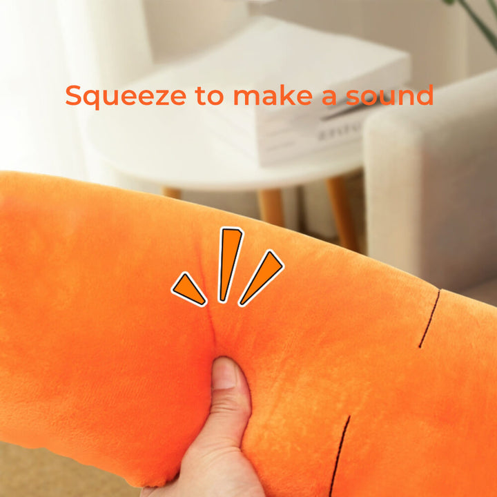 Dog enthusiastically playing with an interactive carrot squeaky plush toy, perfect for enrichment.