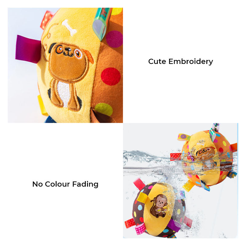 Puppy chewing on a durable interactive squeaky ball toy, a pet supply essential for active dogs.