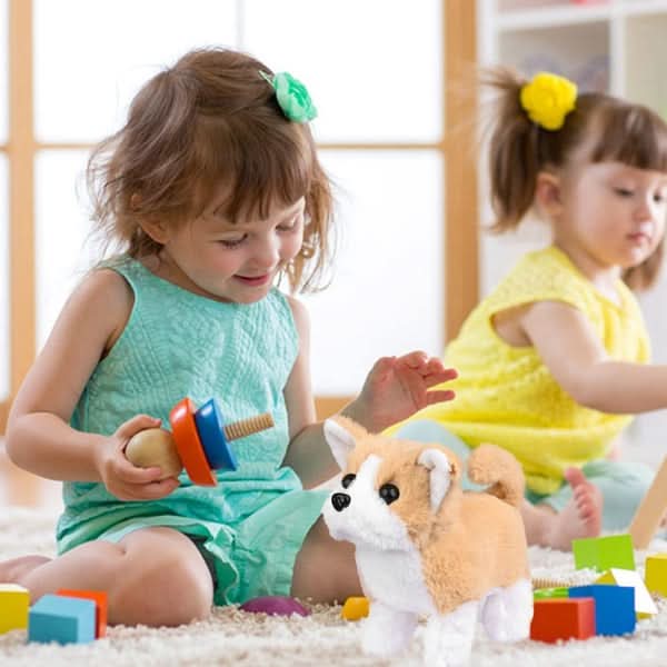 Close-up of interactive plush dog toy, movable legs, soft fur for kids' imaginative play.