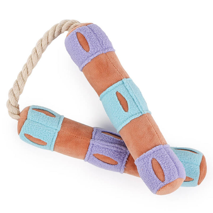 Set of interactive puzzle treat dispenser squeaky dog toys in various colors.