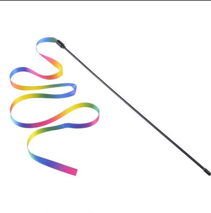 Rainbow teaser wand cat toy captivating a feline, encouraging active play and enrichment for pets.