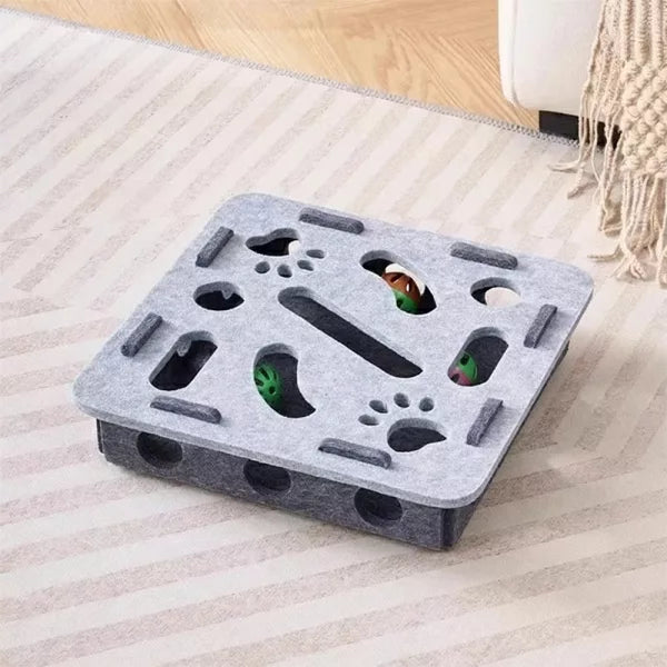 Cat exploring an interactive scratch puzzle box, a fun and functional pet supply for stress-free play.