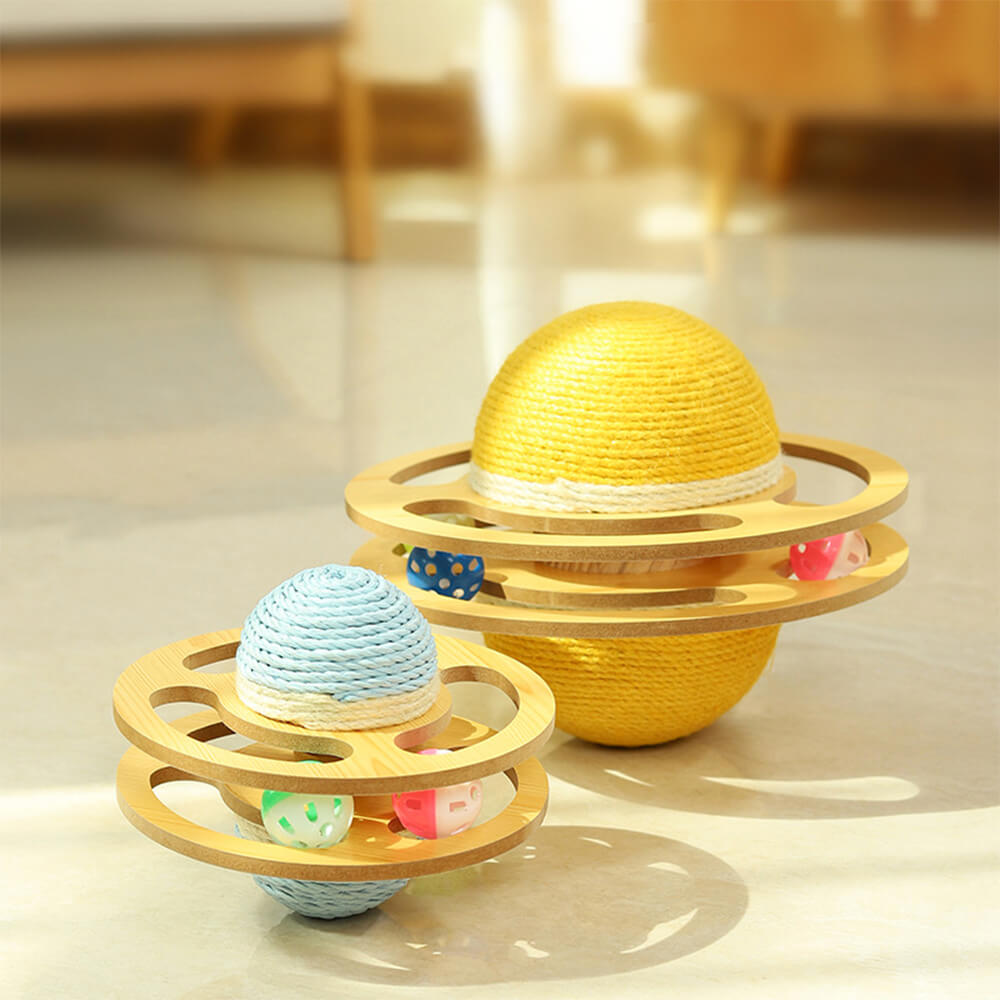 Playful kitten batting an interactive sisal scratching ball cat toy, promoting cat exercise