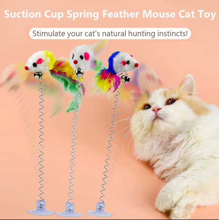 Dynamic shot of a cat playing with a spring mouse toy, showcasing its flexible movement.