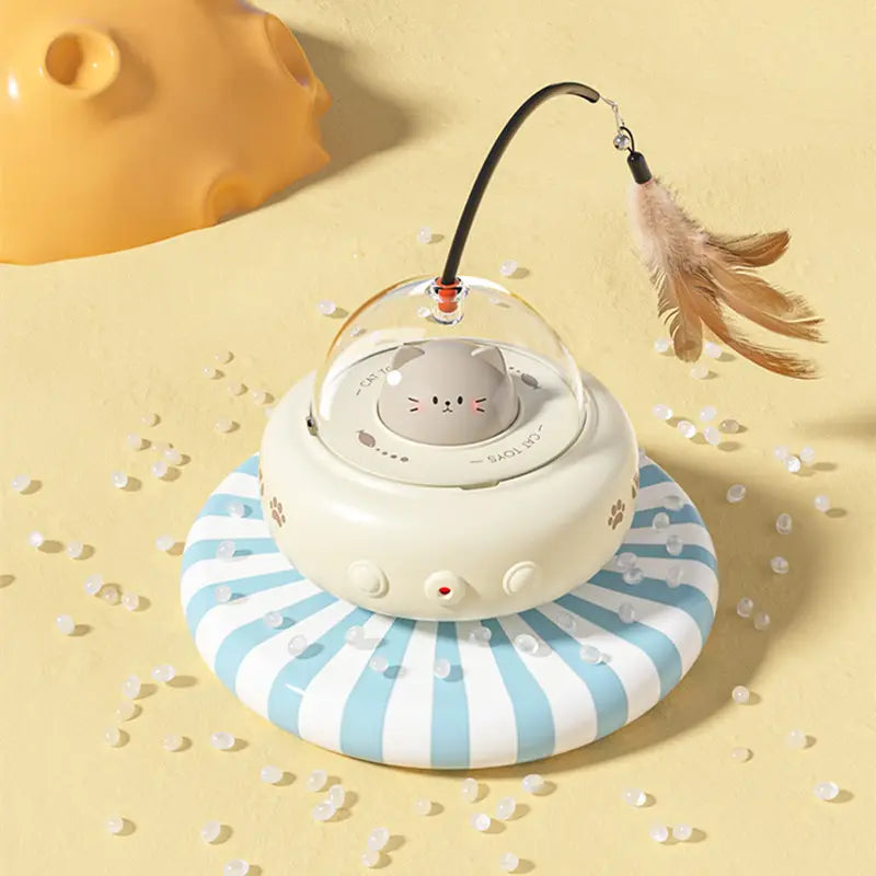 UFO laser cat toy in action with a red dot on the floor and a feather, stimulating feline hunting instincts.