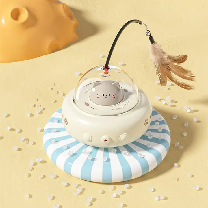 UFO laser cat toy in action with a red dot on the floor and a feather, stimulating feline hunting instincts.