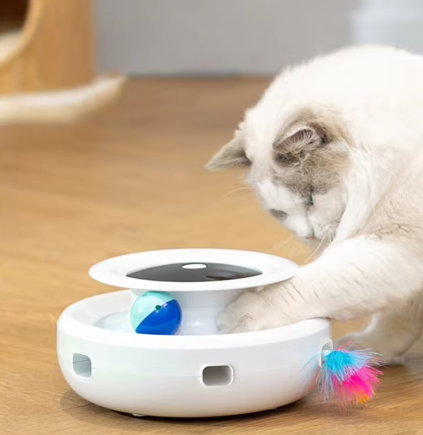 Interactive white cat toy with moving LED light for pet enrichment and exercise