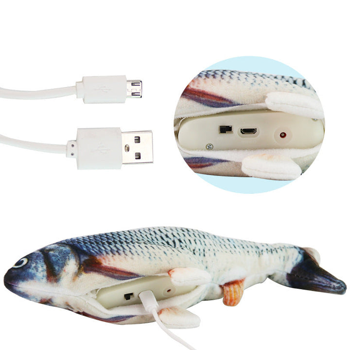 Wiggling fish dog toy lying on a wooden floor, ready for engaging active play and pet entertainment.