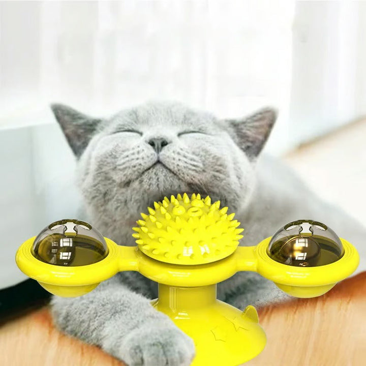 Interactive windmill catnip toy with green and yellow blades, bringing mental stimulation for cats.
