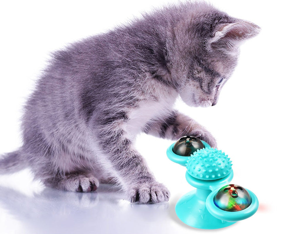 Closeup of a windmill cat toy with an integrated catnip dispenser, perfect for kitten dental care.