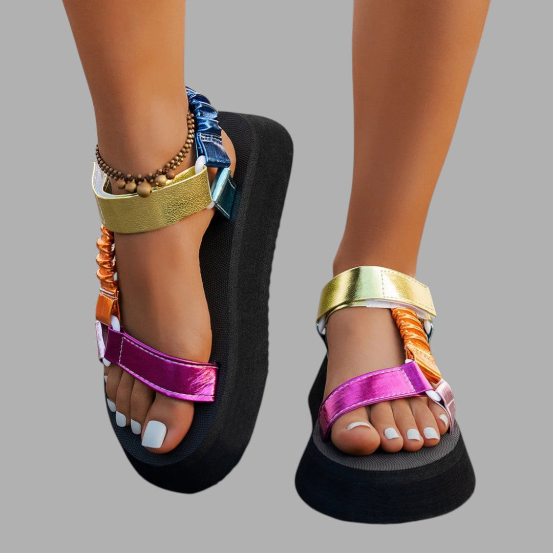 Chic women's platform sandals with iridescent straps, a fashionable statement for summer and elevated evening style.