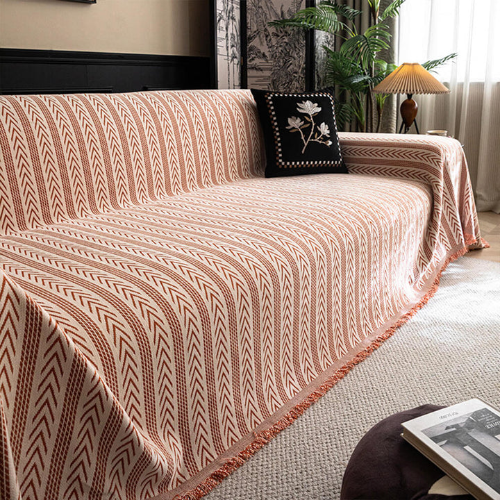 Jacquard tassel chenille couch cover in a cozy living room setting, elegant sofa protector