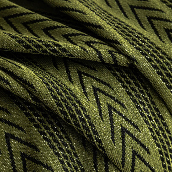 Soft chenille couch cover featuring intricate jacquard weave and playful tassels, furniture throw