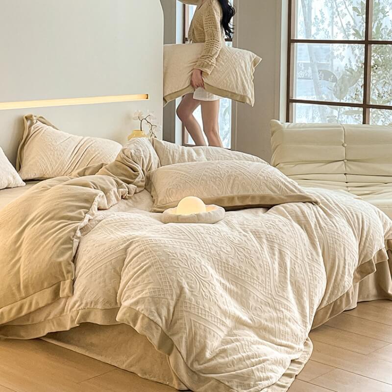 Warm double-sided velvet sheets with an ornate jacquard design, enhancing bedding luxury.