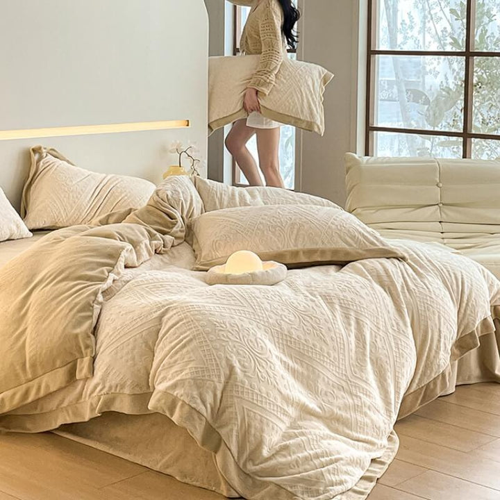 Warm double-sided velvet sheets with an ornate jacquard design, enhancing bedding luxury.