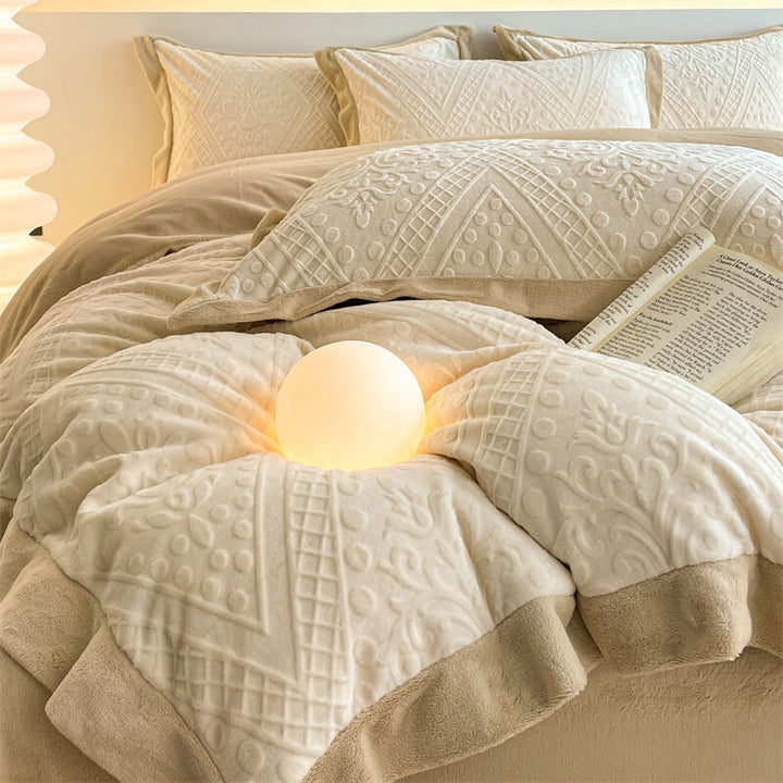 Closeup of soft jacquard velvet bedding showing luxurious texture and detailed pattern.