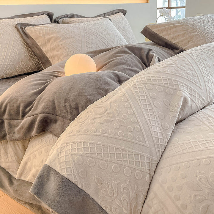 Bedroom decor featuring a bed made with a plush, double-sided jacquard velvet sheet set.
