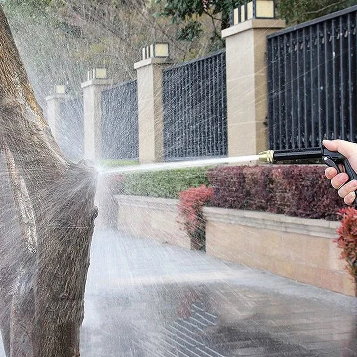 JetSpray water gun for garden cleaning, reaching tough spots with high-pressure hose nozzle. Outdoor cleaning.