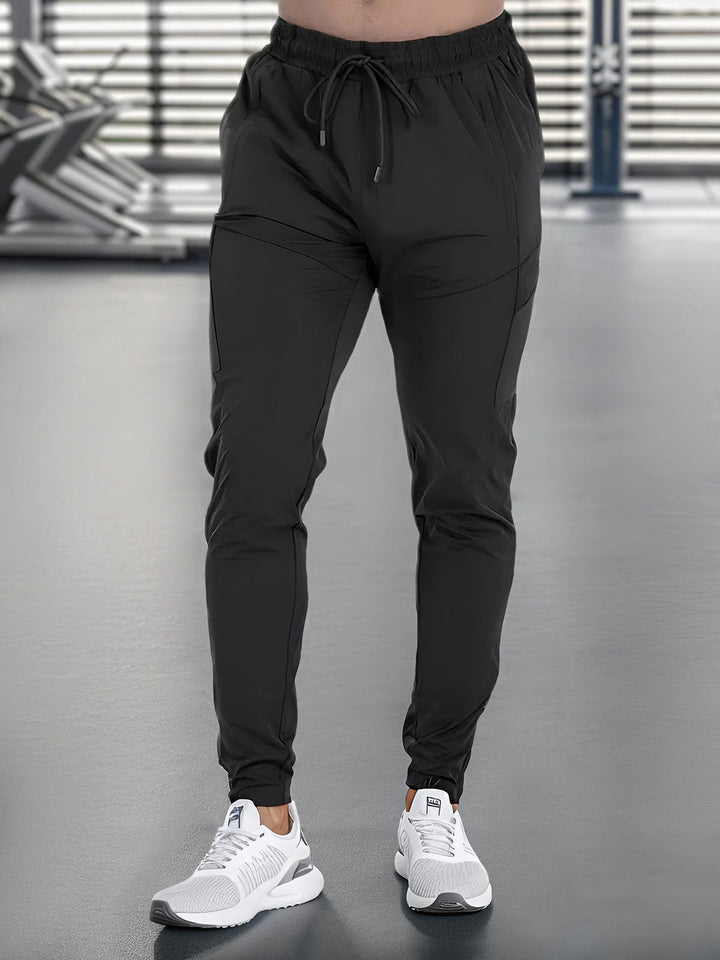 Tapered fit Valenza men's joggers, quick-dry stretch for ultimate comfort & performance.