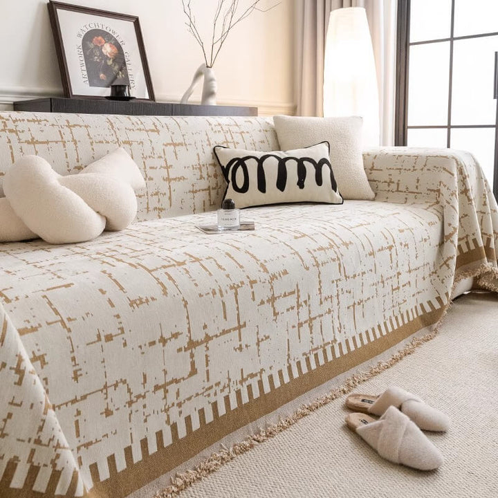 Washable chenille couch cover draped over sofa, offering comfort and home decor style