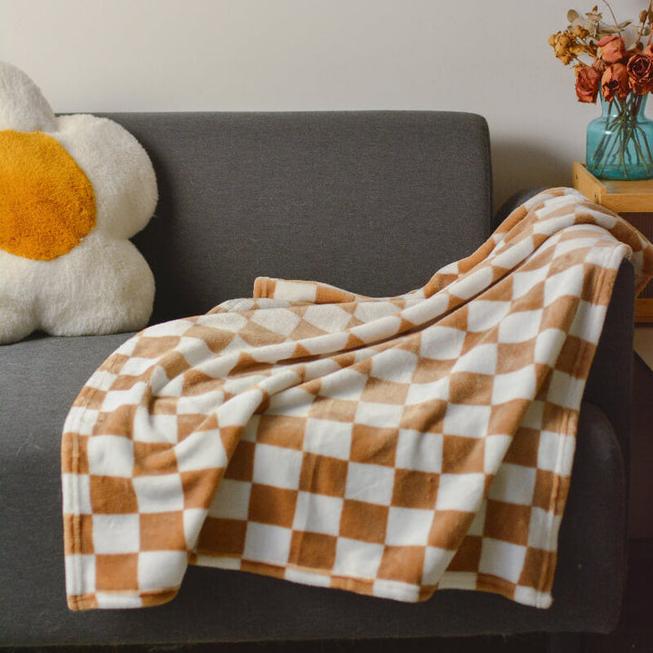 Close-up of khaki and yellow chequered flannel dog mat, ideal for pets, soft texture
