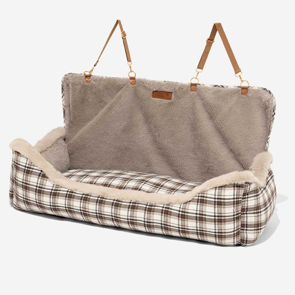 Plush brown dog booster car seat, perfect travel accessory for comfortable pet journeys.