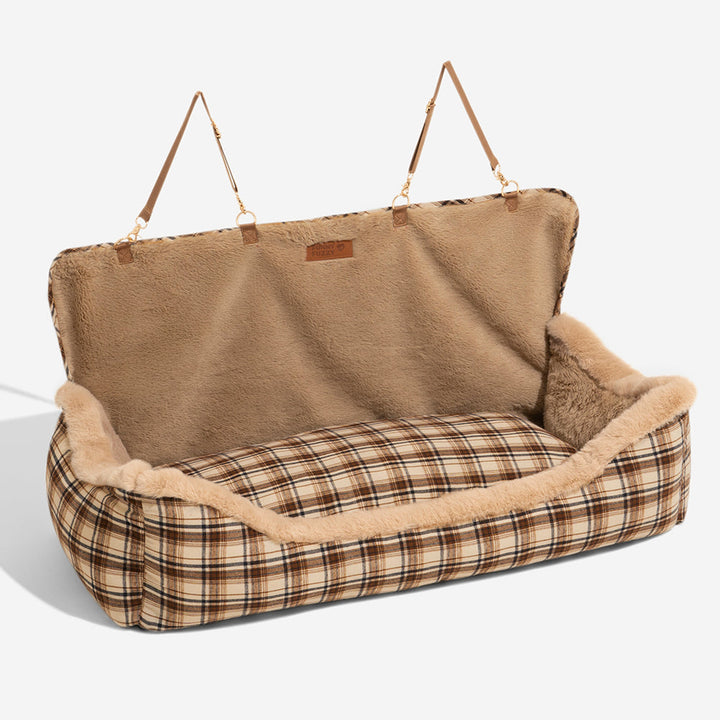 Fluffy grey dog car seat, an essential travel accessory for secure and cozy pet rides.