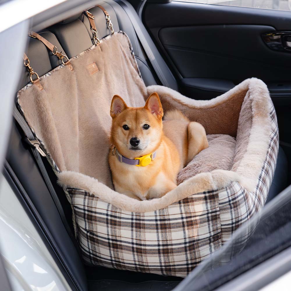 Brown dog car seat booster with safety straps for small dogs, ideal travel accessory.