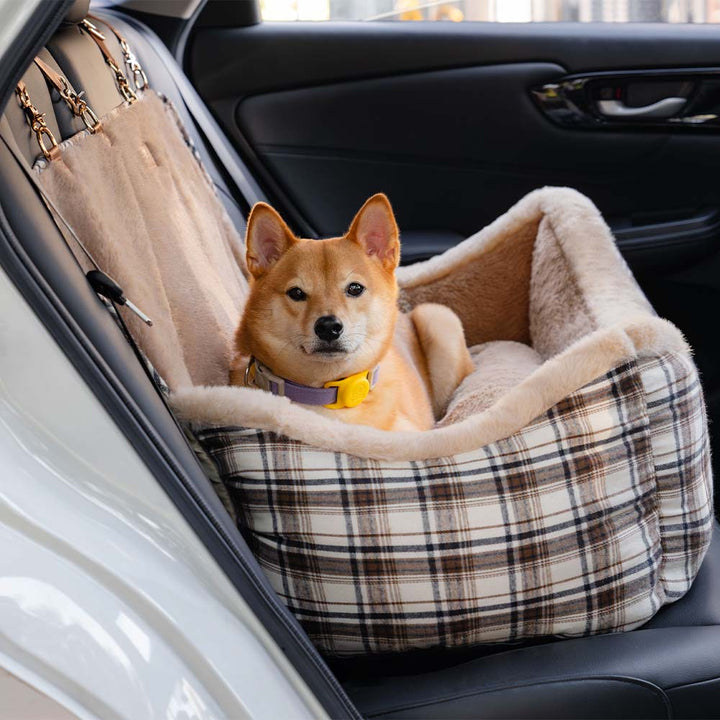 Grey fluffy pet booster car seat, ensuring dog safety and comfort during travel.