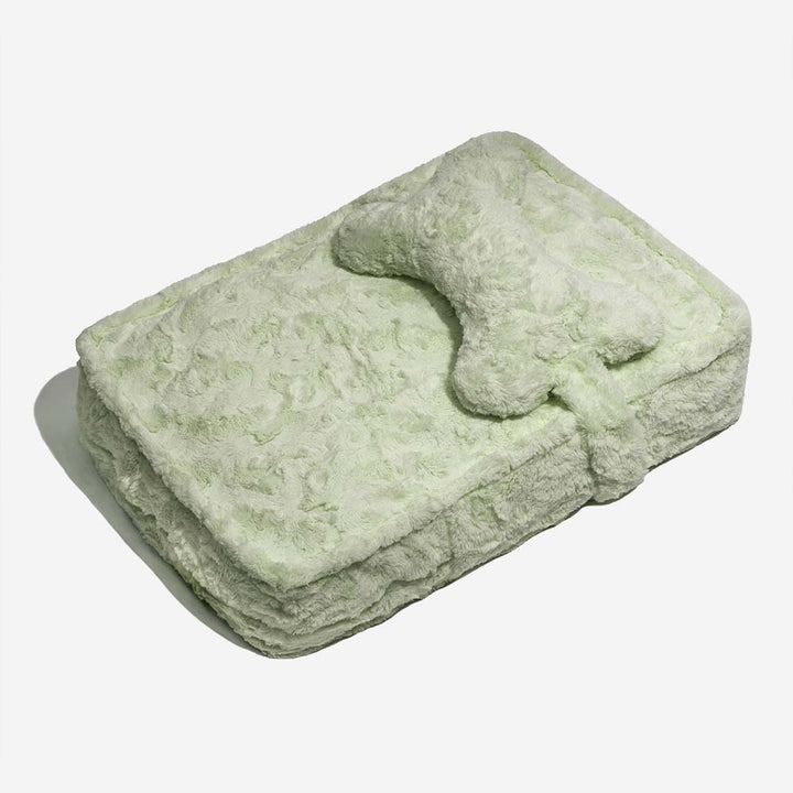 Plush grey pet bed, bone-shaped cushion, warming and fluffy, designed for ultimate pet comfort.
