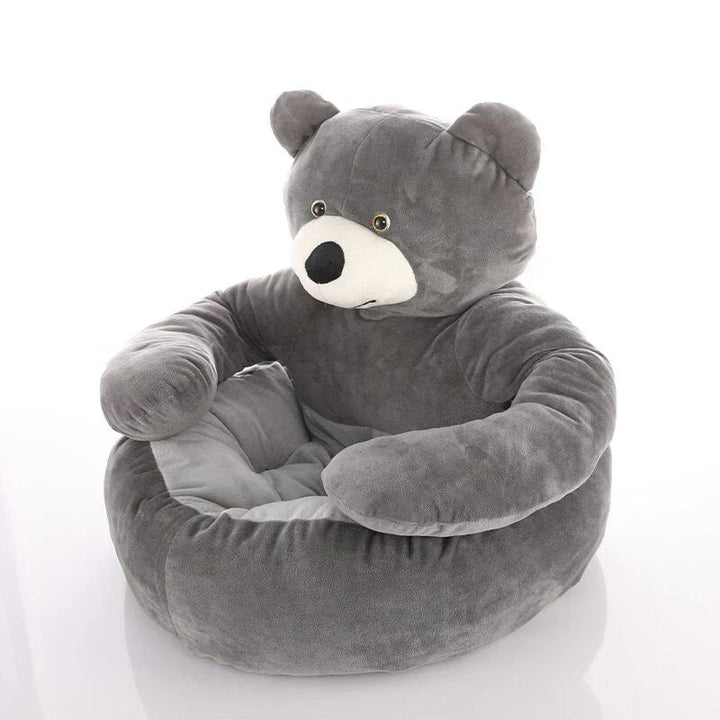 Small dog nestled in a grey teddy bear bed, deep comfort and support pet furniture